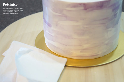 Wipe any drips off  your cake board